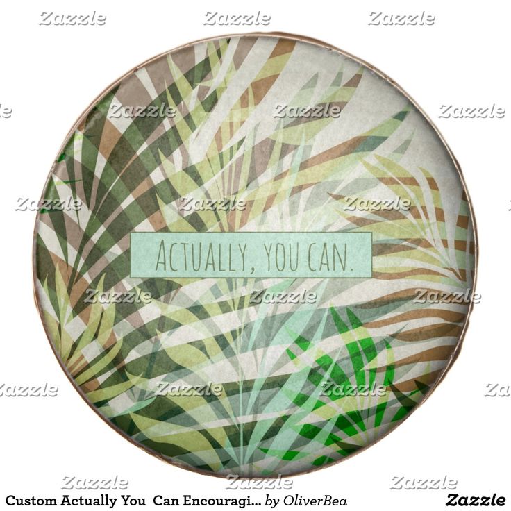 a green and brown plate with some leaves on it that says actually you can written in the center