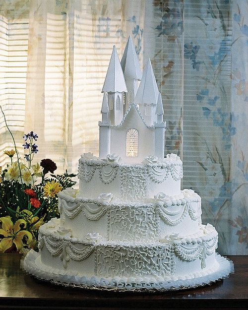 a large white cake sitting on top of a table