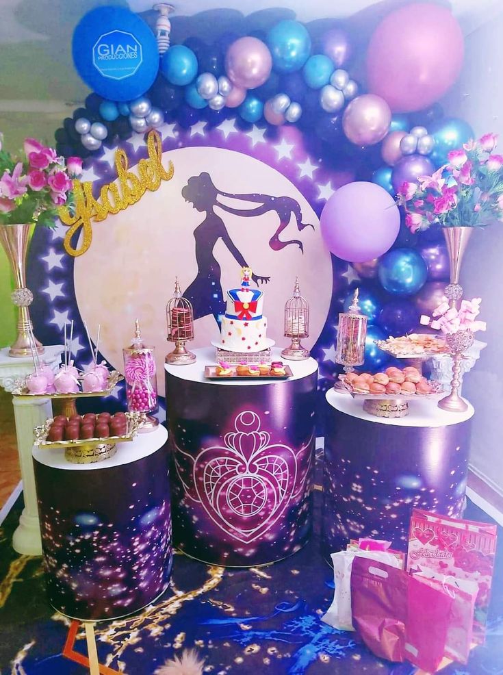 an image of a birthday party setting with balloons and desserts on the table in front of it