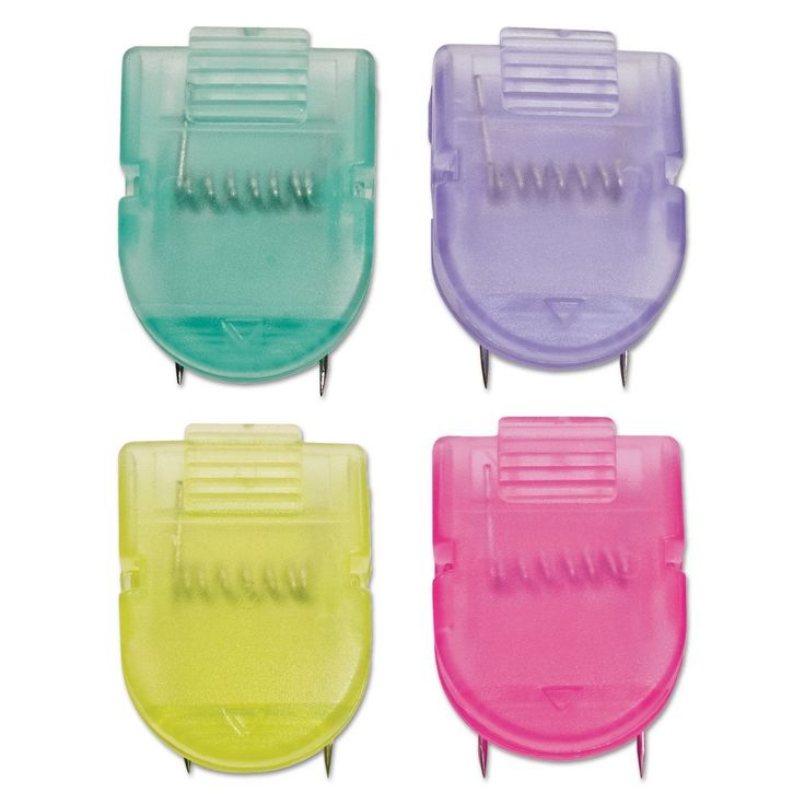 four different colored plastic toothbrush holders on a white background