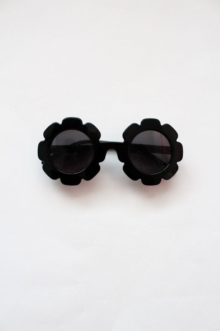 Cute & trendy sunglasses in a flower design perfect for your littles! Also available in the colors white and pink! Cute Black Sunglasses With Uv Protection, Fun Black Sunglasses For Vacation, Trendy Flower-shaped Sunglasses For Summer, Playful Black Plastic Sunglasses, Trendy Flower-shaped Tinted Sunglasses, Flower Kids, Flower Sunglasses, Trendy Sunglasses, Children's Boutique