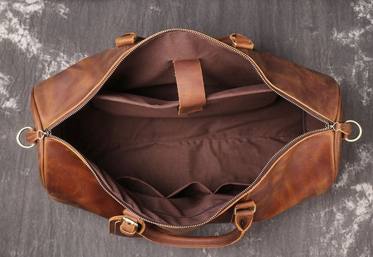 Make every business trip a luxurious experience with this stylish Large Capacity Genuine Leather Travel Duffel Handbag from iBuyXi. Expertly crafted from soft genuine leather, its spacious design and elegant look will ensure you make a lasting impression. Are you ready to elevate your travels? Shop now! SPECIFICATIONS Travel Bag: Travel Duffle Style: Business Pattern Type: Solid Occasion: Business Material Composition: Genuine Leather Item Width: 23cm Item Weight: 1.9kg Item Type: Travel Bags It Business Travel Tote Bag With Leather Lining, Leather-lined Tote Travel Bag For Business Trips, Elegant Leather Weekender Bag With Luggage Sleeve, Leather Satchel For Business Trips, Leather Satchel Travel Bag For Business Trips, Leather Bags With Leather Lining For Business Trips, Leather Business Travel Bag With Luggage Sleeve, Business Travel Bag With Luggage Sleeve In Leather, Formal Soft Leather Weekender Bag