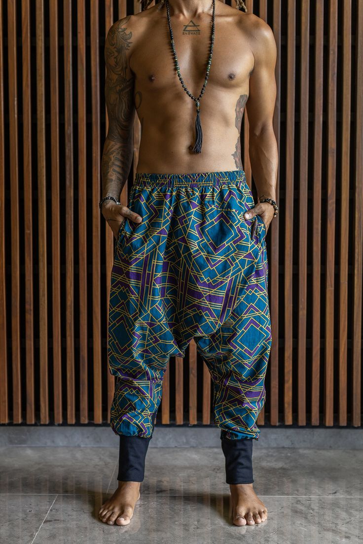 Harem Pants Men, Rave Outfit Men, Psychedelic Pants VALO SPIRIT NINJA Blue Geometric - Comfortable & stylish cotton print harem pants Slim leg drop crotch harem sarouel pants. You can wear them long for a warmer feel or pulled up on the shin or below the knee. The fabric is well breathing, smooth 100% cotton. Two Zipper pockets to keep your valuables safe! Inside fabric of the pockets is made from bamboo stretch. Allows freedom of movement without restrictions. COMBINES PERFECTLY with the tops f Wide Leg Pants With Elastic Waistband For Festivals, Harem Pants With Pockets For Festivals, Straight Festival Pants With Pockets, Baggy Ankle-length Pants For Festival, Festival Ankle-length Pants With Pockets, Casual Pants With Pockets For Festivals, Casual Festival Pants With Pockets, Traditional Blue Bottoms For Festivals, Blue Harem Pants With Pockets For Festival