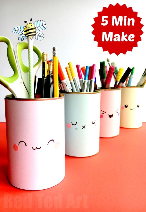 three mugs with pens, pencils and scissors in them sitting on a table