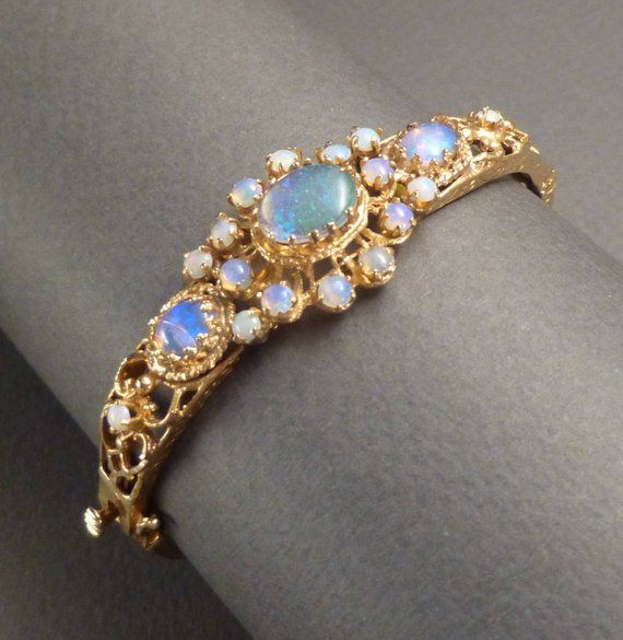 14K and Opal Hinged Bracelet Antique Opal Jewelry In Yellow Gold, Yellow Gold Multi-stone Moonstone Jewelry, Gold Multi-stone Moonstone Jewelry, Antique Opal Jewelry In Gold, Antique Gold Opal Jewelry, Heirloom Round Jeweled Jewelry, Vintage Opal Jewelry In Yellow Gold, Victorian Opal Jewelry In Yellow Gold, Gold Opal Multi-stone Jewelry