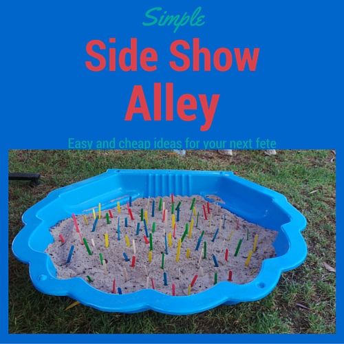 a blue plastic sandbox filled with candles on top of green grass and the words, simple side show alley