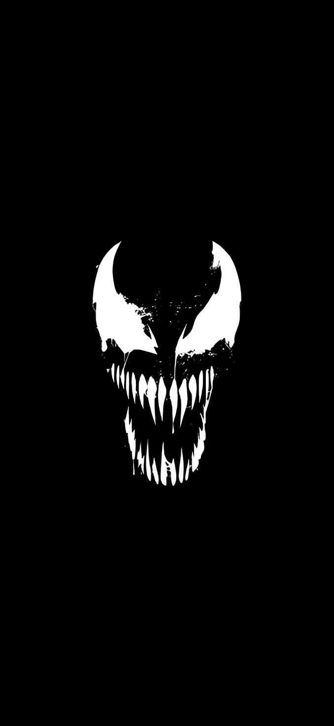 a black and white image of an evil monster's face with fangs on it