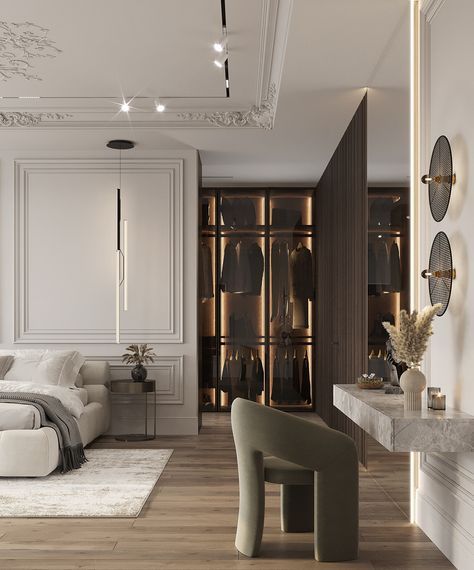 a bedroom with white walls and wood flooring has a large bed, two chairs, an armless chair, and a built - in closet