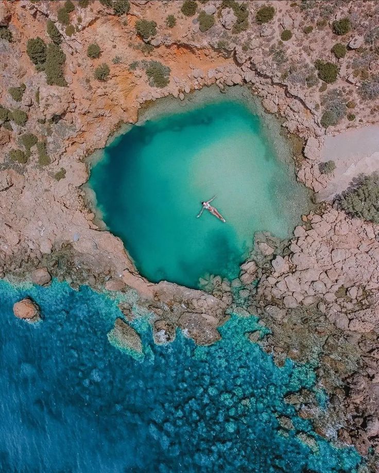 an aerial view of a body of water surrounded by land