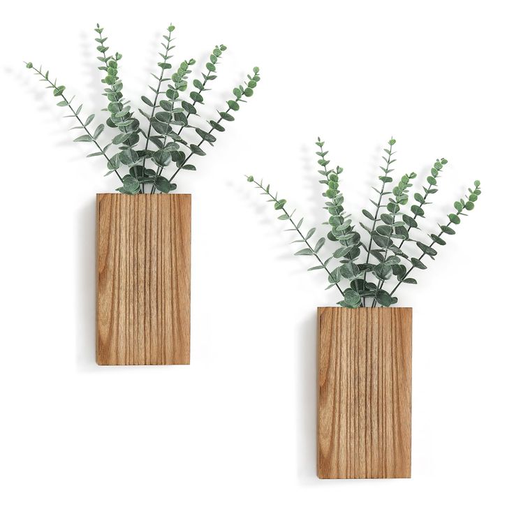 two wooden vases with plants in them