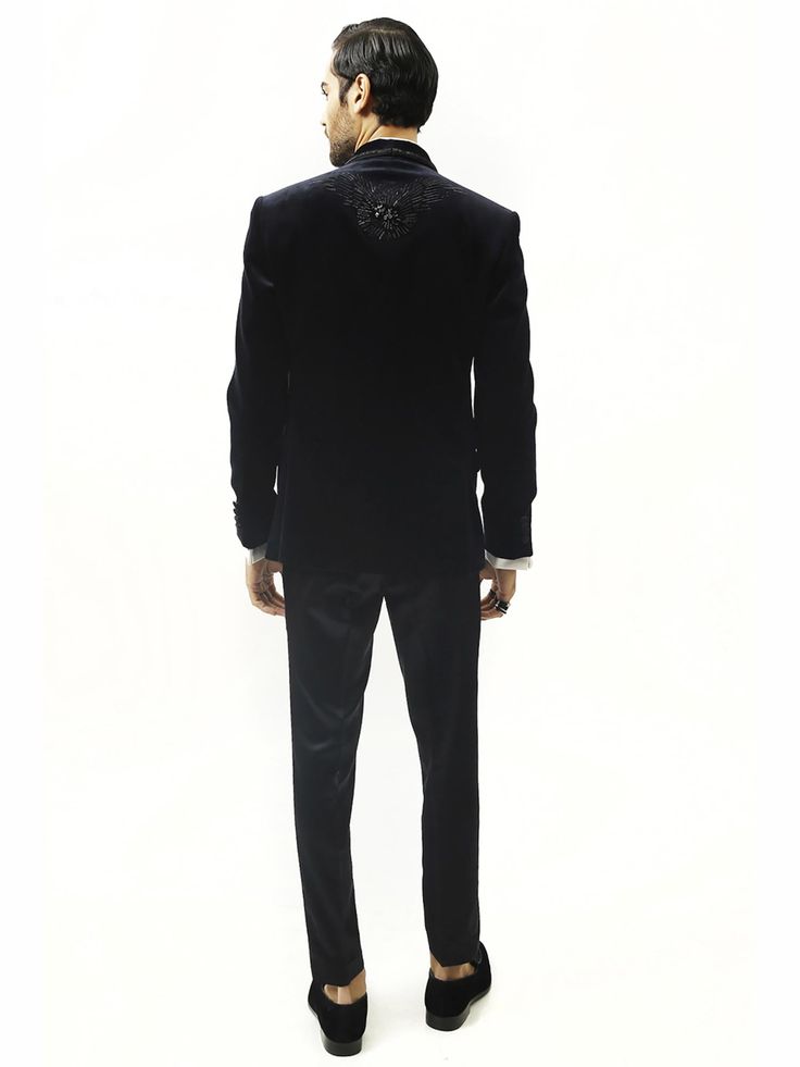 Astrum handcrafted tuxedo is highlighted with metallic threads. Single-buttoned satin detail shawl collar. This creation in velvet can be tempered with flat-front trousers for a reception look. Elegant Velvet Party Set, Velvet Tuxedo For Winter Party, Velvet Tuxedo Style Blazer For Semi-formal Events, Tailored Tuxedo Sets For Gala, Velvet Party Suits For Winter, Velvet Winter Party Suits, Luxury Velvet Blazer For Parties, Winter Velvet Party Suits, Luxury Velvet Party Blazer