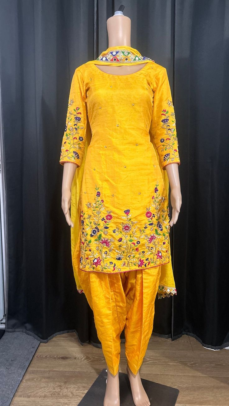 Hand embroidered yellow suit on khadar silk. Traditional Drape Yellow Lawn Suit For Festivals, Yellow Lawn Suit With Traditional Drape For Festivals, Yellow Silk Sets For Spring, Anarkali Style Yellow Lawn Suit With Traditional Drape, Bollywood Style Yellow Lawn Suit In Traditional Drape, Yellow Anarkali Lawn Suit With Traditional Drape, Bollywood Style Yellow Lawn Suit With Traditional Drape, Traditional Embroidered Semi-stitched Suits, Yellow Bollywood Lawn Suit With Traditional Drape