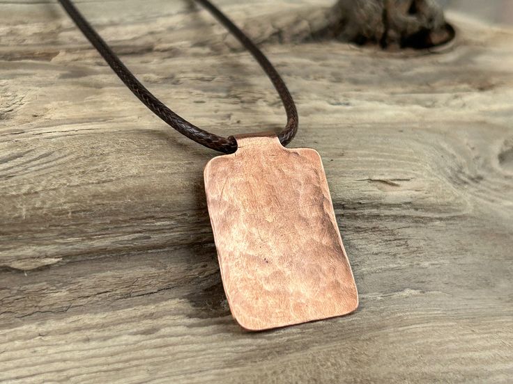 The Keith Collection hammered copper pendants - the essence of rustic charm and the grounding spirit of copper.  Copper, with its earthy hue and grounding qualities is akin to the steadfastness of friendship.  Crafted by hand the hammered texture adds a unique rustic dimension, reflecting the organic patterns found in nature. This collection is a celebration of imperfections, reminding us of the beauty that arises from life's twists and turns. These pieces hold a special place in our hearts, as Rust Colored Hammered Copper Jewelry, Rustic Hand Forged Brown Jewelry, Rustic Brown Hand Forged Jewelry, Rustic Bronze Electroformed Necklace, Rustic Brown Hammered Jewelry, Adjustable Copper Hammered Necklace, Adjustable Hammered Copper Necklace, Brown Patina Necklace For Gift, Hammered Brown Jewelry For Gift