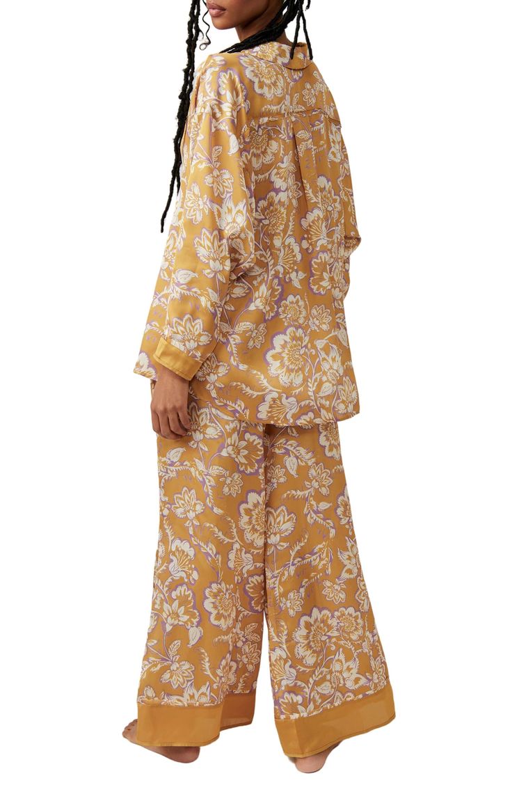 Make bedtime a bit more boho in flowery pajamas that live up to their dreamy designation. 28 1/2" to 31" top length; 28" inseam; 32" leg opening; 14" front rise; 17" back rise (size Medium) Top has spread collar; long sleeves 100% polyester Hand wash, line dry Imported Spring Matching Set Sleepwear, Spring Sleepwear Matching Set For Sleepover, Spring Matching Set Sleepwear For Sleepover, Spring Sleepover Matching Sleepwear Set, Spring Sleepwear With Relaxed Fit For Bedtime, Relaxed Fit Sleepwear For Spring Bedtime, Relaxed Fit Spring Sleepwear For Bedtime, Relaxed Fit Matching Sleepwear Set For Sleepovers, Oversized Fall Sleepwear For Lounging