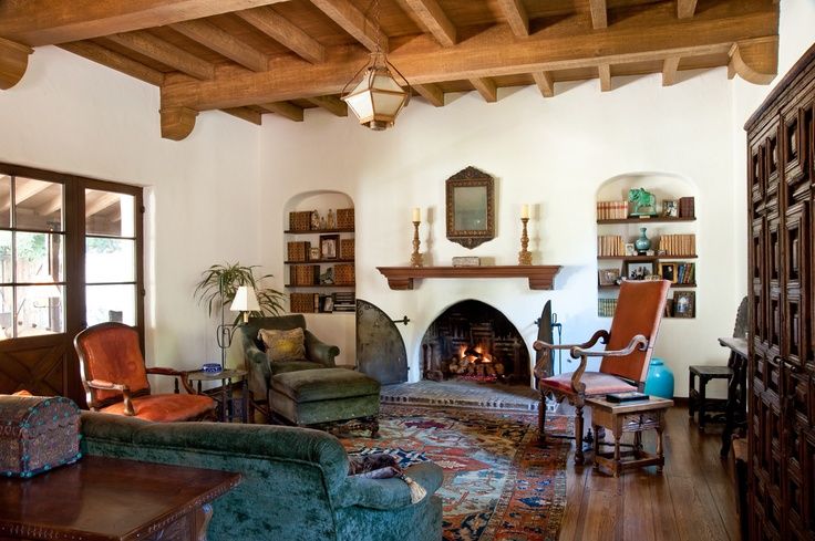 a living room filled with furniture and a fire place