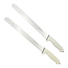 two knifes sitting next to each other on a white surface