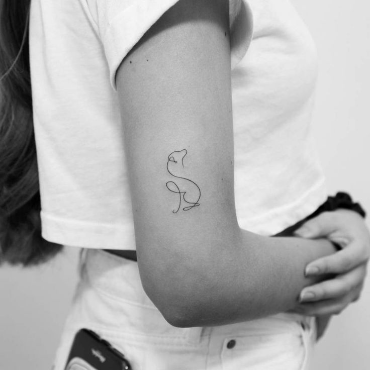 a woman with a small tattoo on her arm