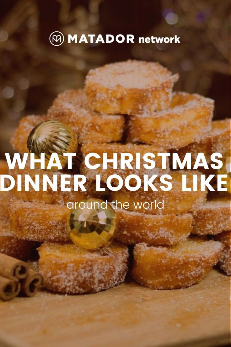 a pile of doughnuts with the words what christmas dinner looks like around the world