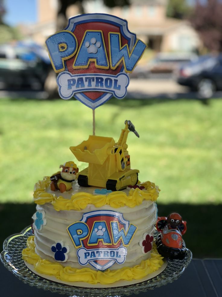 a birthday cake with paw patrol decorations on top