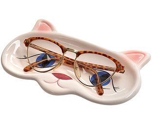 a cat shaped eyeglass holder with glasses on it's face and the lid