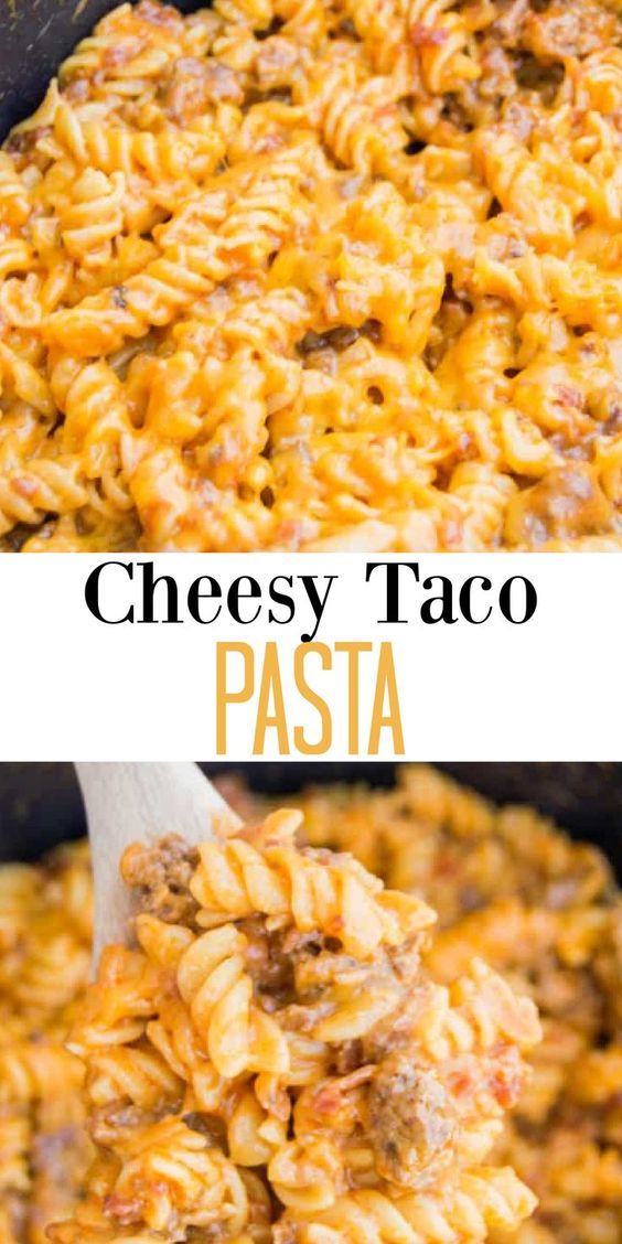 cheesy taco pasta in a skillet with a wooden spoon and text overlay