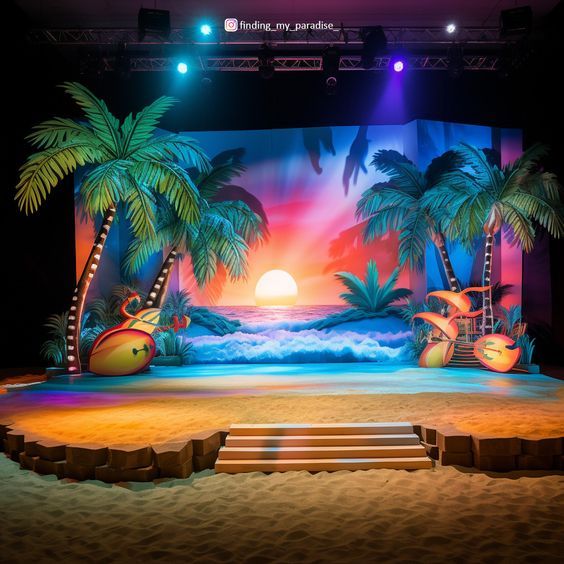 an outdoor stage set with palm trees and beach scene in the background at night time