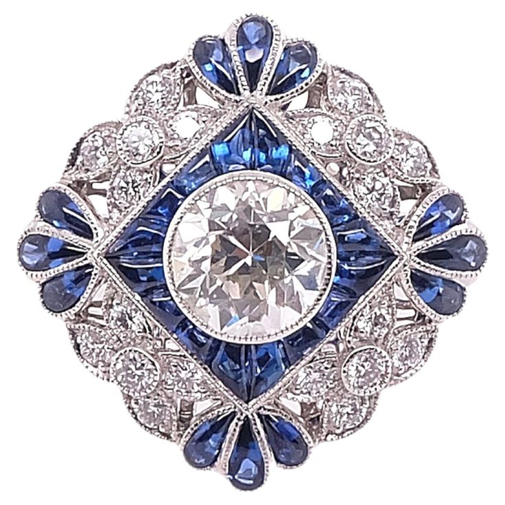 Art Deco style ring that is set in platinum. The ring features a round cut center diamond that weighs 0.93 carat complemented with blue sapphires that weigh 0.95 carats and small diamonds that weigh 0.25 carats. Sophia D by Joseph Dardashti LTD has been known worldwide for 35 years and are inspired by classic Art Deco design that merges with modern manufacturing techniques. Inspiration Art, Antique Diamond Rings, Vintage Style Rings, Estilo Art Deco, European Cut Diamonds, Platinum Ring, Art Deco Ring, Diamond Art, Vintage Diamond