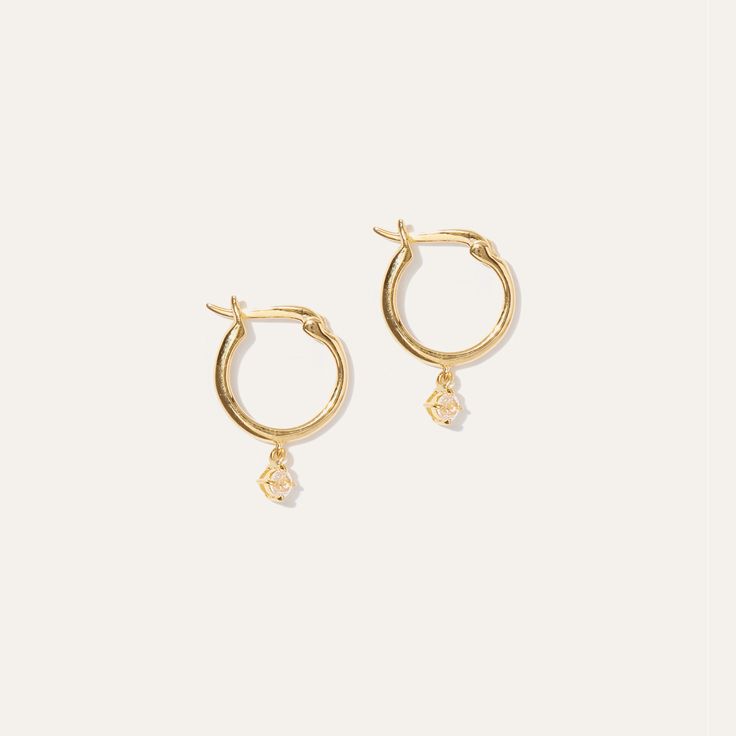 The classic hoop re-imagined with a subtle dose of sparkle. Handcrafted in vermeil – thick 18k gold layered over solid sterling silver.  | Quince | Women's White Sapphire Drop Hoop Earrings in Gold Vermeil, Precious Jewelry Everyday Luxury Gold Hoop Huggie Earrings, Everyday Yellow Gold Huggie Earrings In Sterling Silver, Delicate Yellow Gold Small Hoop Huggie Earrings, Everyday Yellow Gold Sterling Silver Huggie Earrings, Timeless Gold Diamond Cut Huggie Earrings, Timeless Gold Huggie Earrings With Diamond Cut, Delicate Yellow Gold Huggie Earrings For Everyday, Delicate Sterling Silver Hoop Earrings In Yellow Gold, Timeless Yellow Gold Plated Hoop Earrings