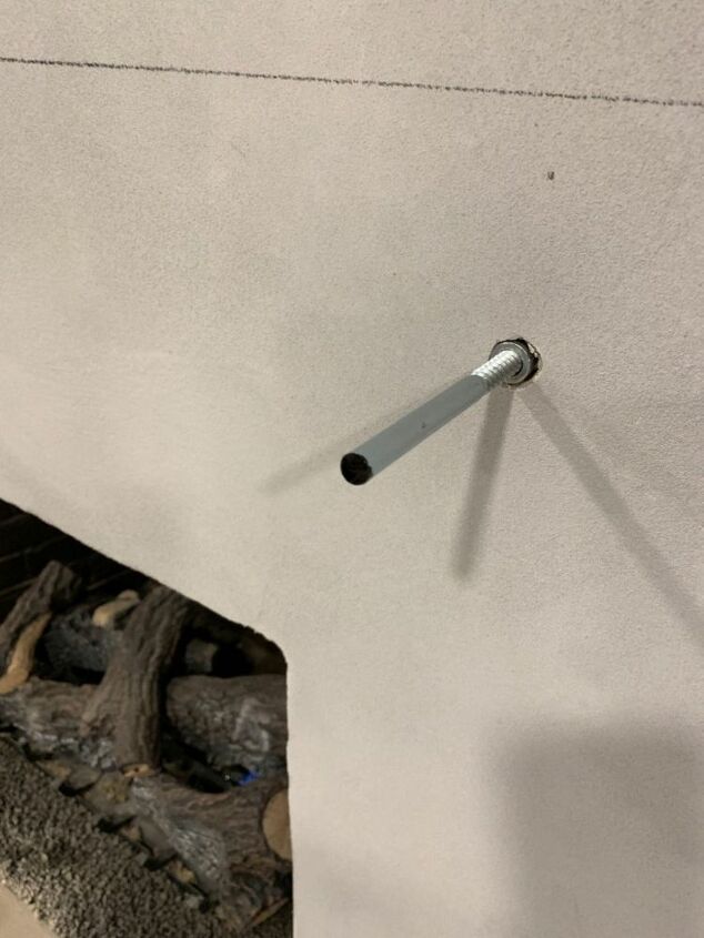 a piece of metal is stuck to the wall