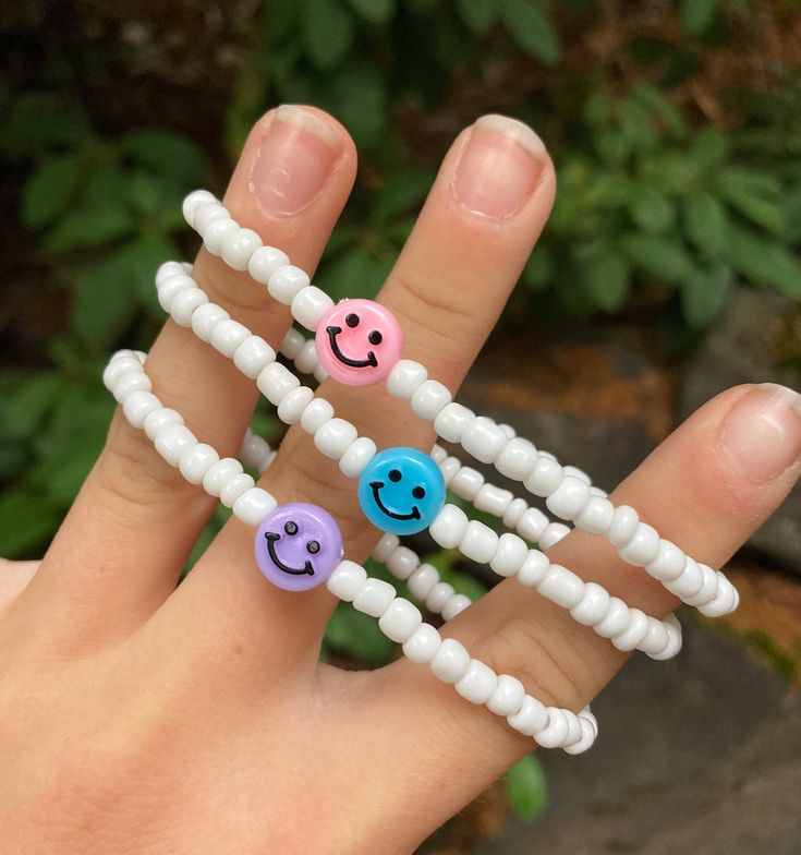 White Hypoallergenic Friendship Bracelets For Everyday, Trendy Everyday Bracelets, Trendy Everyday Bracelets With Smiley Face, Trendy Everyday Bracelet With Smiley Face, Trendy Everyday Smiley Face Bracelet, Trendy White Stacked Beaded Bracelets, Casual White Stackable Beaded Bracelets, Casual Stacked Jewelry For Everyday, Casual Stacked Jewelry For Everyday Wear