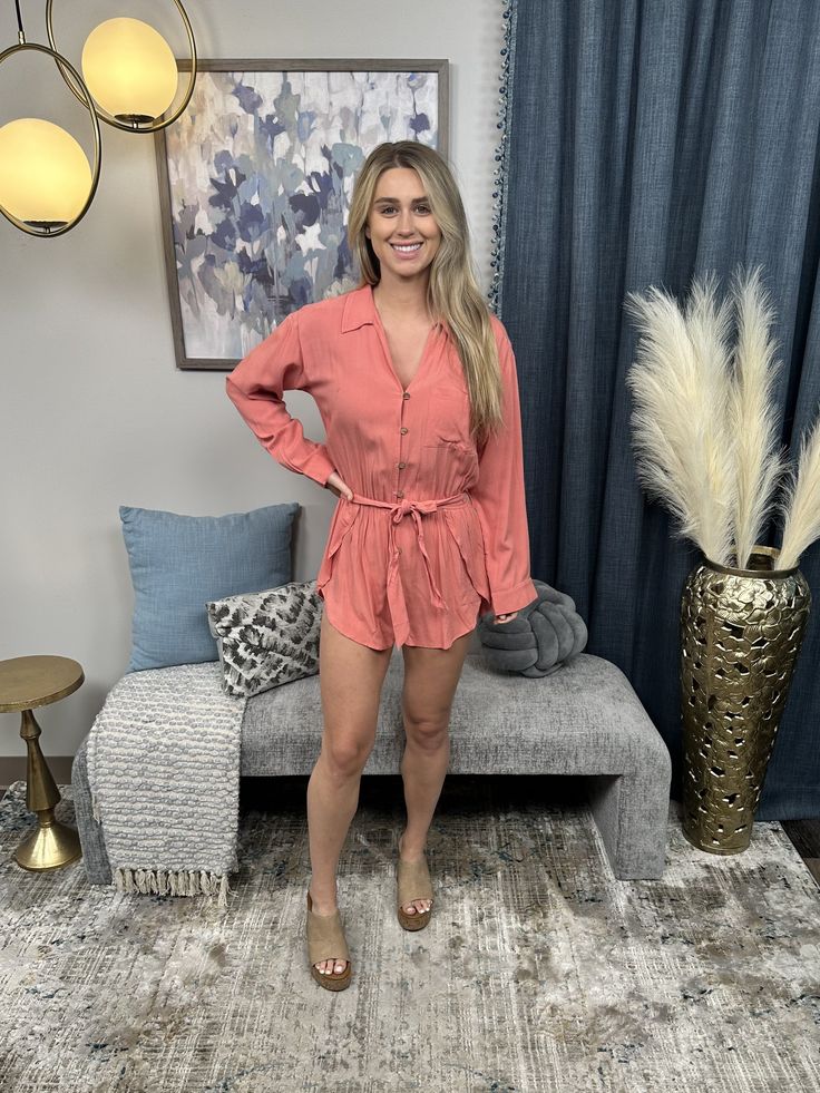 The So Worth It Romper by Heyson Is the perfect outfit for any occasion, from brunch to date night. This romper features a button-up v neckline, a front chest pocket, a self tie belt, and an elastic waist band. The soft and breathable fabric will keep you comfortable all day long. The solid color makes it easy to accessorize and style. Youâ€™ll love how this romper shows off your legs and makes you look effortlessly chic. Fabric: 65% Rayon, 35% Polyester Measurements: Bust (Size M): 18" Length ( Casual Belted V-neck Jumpsuits And Rompers, Belted Jumpsuits And Rompers For Spring Vacation, Casual Jumpsuits And Rompers With Tie Waist For Vacation, Summer Long Sleeve Jumpsuits For Day Out, Belted V-neck Jumpsuits And Rompers For Vacation, V-neck Belted Jumpsuits And Rompers For Vacation, Belted V-neck Jumpsuit For Vacation, Spring Belted Jumpsuits And Rompers For Day Out, Summer Vacation Button-up Jumpsuits And Rompers