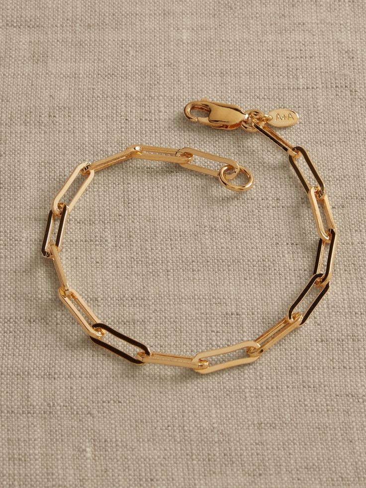 Create a delicate statement with this elongated paperclip chain bracelet or layer with other bracelets.  Timeless Classics: Luxury, everyday.  A showcase of time-honored craftsmanship and skilled Italian artisans, these are the pieces you'll reach for season after season, delighting in their exceptional versatility and endless appeal.  Lobster clasp.  12K-gold plated or silver-plated bronze.  Made in Italy.  Length: 7. 5" Jewellery Photo, Jewelry Design Necklace, Paper Clip, Photo Jewelry, Chain Bracelet, Lobster Clasp, Jewelry Pieces, Silver Color, Silver Plate