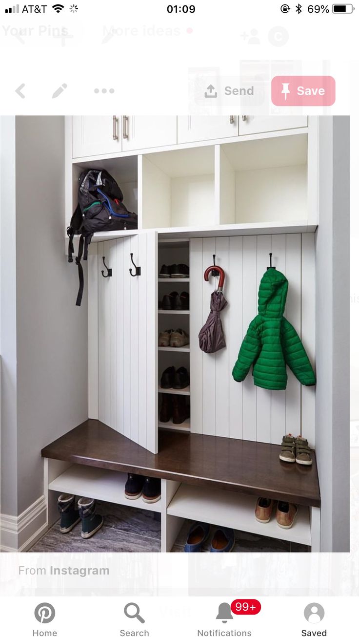 an image of a room with shoes and coat racks on the wall in front of it