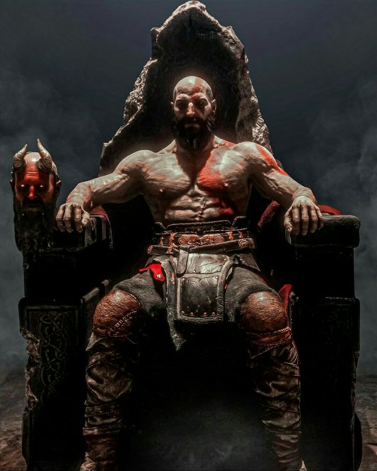 a man sitting on top of a stone throne