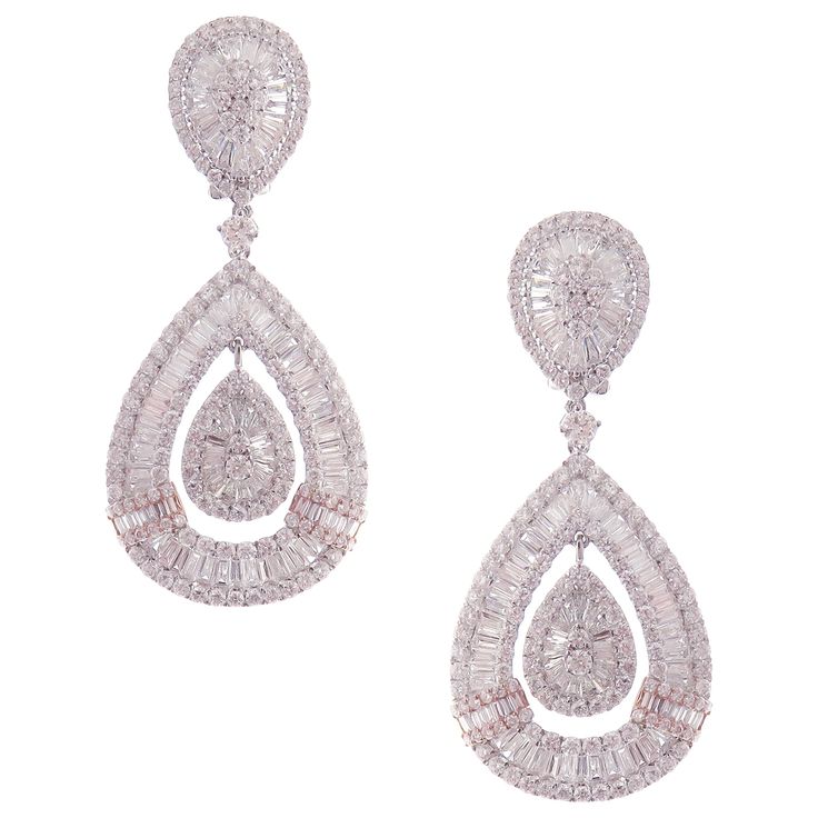 These modern pear baguette earrings are crafted in 18-karat white gold, weighing approximately 11.82 total carats of SI-V Quality white diamond. French Clip backing. Beautiful rose gold accent. Our Ballroom Collection feature earrings for those with bold/classy aesthetics and elegant tastes. 304 Round Diamonds = 5.87 ct 182 Baguette Diamonds = 5.95 ct Classy Aesthetics, Baguette Earrings, Baguette Earring, Pear Earrings, French Clip, Rose Gold Accents, Diamond Dangle Earrings, Baguette Diamonds, Circle Diamond