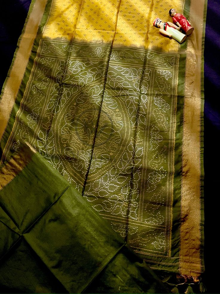 Fabric Details :Enhance your traditional attire with our Pine Yellow Premium Raw Silk Saree. Made with high-quality raw silk, this saree boasts a beautiful pine yellow color that will make you stand out. Its premium material ensures durability and comfort, making it perfect for any formal or special occasion. Elevate your wardrobe with this elegant and timeless saree. Generate again Keep Saree Color : Pine Yellow Saree Work : Thread Woven Saree Length : 5.5 Meter Blouse Length : 0.8 Meter Wash : Pista Green Slub Silk Traditional Wear, Green Silk Unstitched Suit With Cutdana Details, Semi-stitched Gold Bandhani Print Saree, Gold Semi-stitched Saree With Bandhani Print, Pista Green Raw Silk Traditional Wear For Festivals, Traditional Green Silk Unstitched Suit, Traditional Slub Silk Kurta With Bandhani Print, Green Handloom Raw Silk Traditional Wear, Green Raw Silk Handloom Traditional Wear