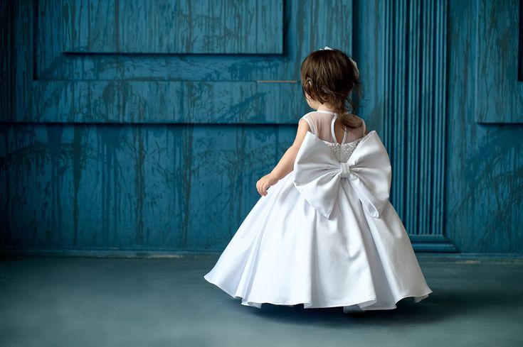 "Beautiful baptism gown - perfect outfit for christening or birthday . The top of dress is made of quality satin with nice pearls. The lining of dress is 100%-cotton. You may also order accessories to these dresses. Christening shoes, baptism blanket. If you have any doubts, please contact us so we can help you find the best size. The weight and height of a child is not a good way to determine size. We recommend dress sizes based on the chest measurement of the child. The measurements listed below are the actual measurements of the gown, not of your child. If your child has a 20\" chest, please add 2-2.5\" movement allowance while selecting the dress size.. In this case, the child with the 20\" chest would need our 12-18 months size. Newborn: Chest: 18\", Length: 18\" 0-3 months: Chest:20\ Elegant Fitted Princess Dress For Baptism, Princess Style Baptism Dress With Bow, Elegant Baptism Dress With Bow For Party, Elegant Princess Dress For First Communion, Elegant Baptism Dress With Satin Bow For Pageant, Princess-style Baptism Dress With Bow, White First Communion Dress With Satin Bow For Party, Princess Dress With Satin Bow For Baptism, Elegant White Princess Dress For First Communion