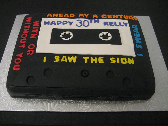 a cake made to look like an old school cassette tape with the words happy 30th really on it