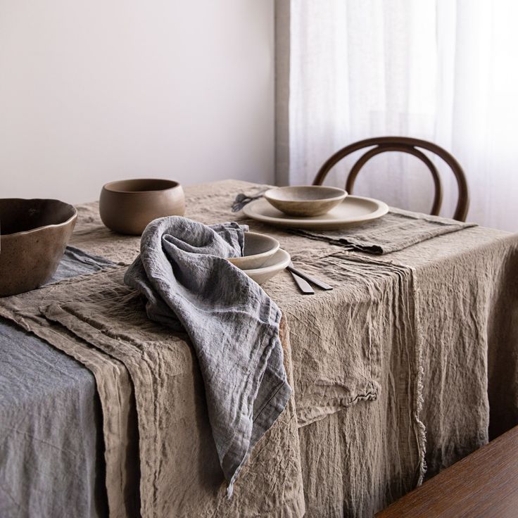 a table with plates and bowls on it