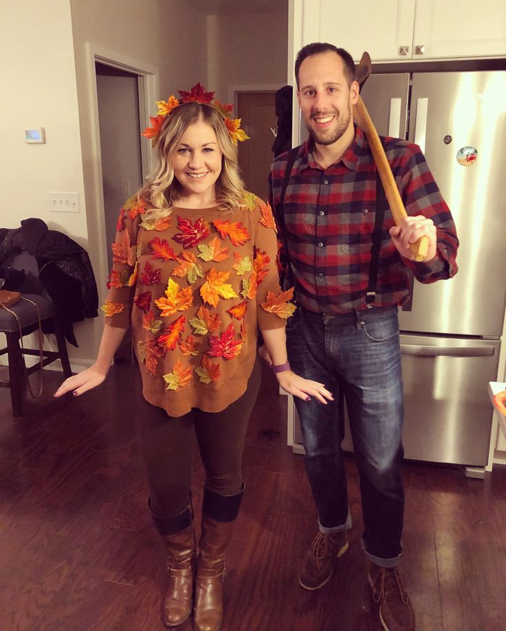 the man and woman are dressed up in thanksgiving costumes for halloween, standing next to each other