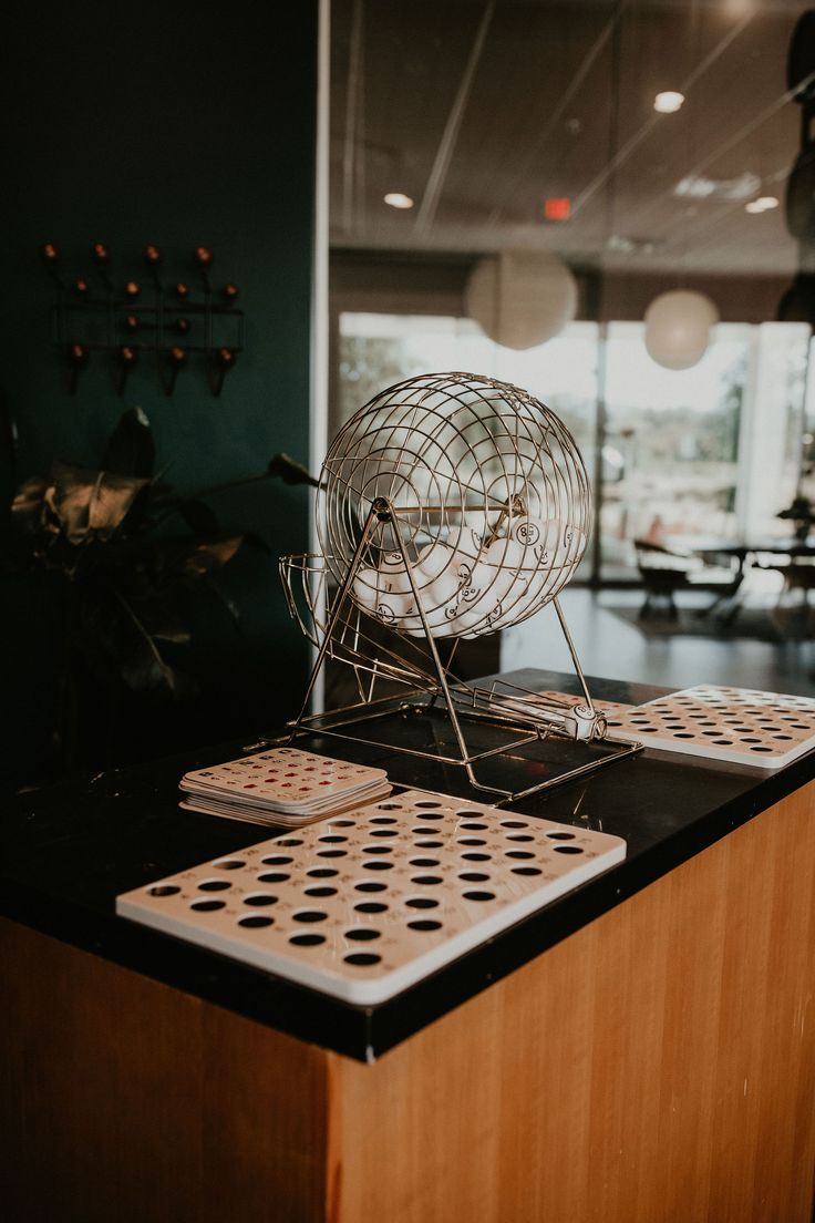 a metal object sitting on top of a wooden table