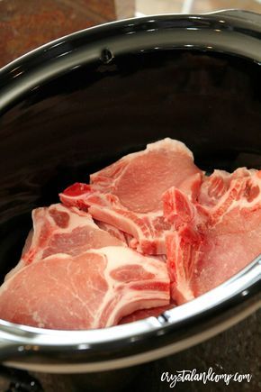 raw meat in a slow cooker ready to be cooked