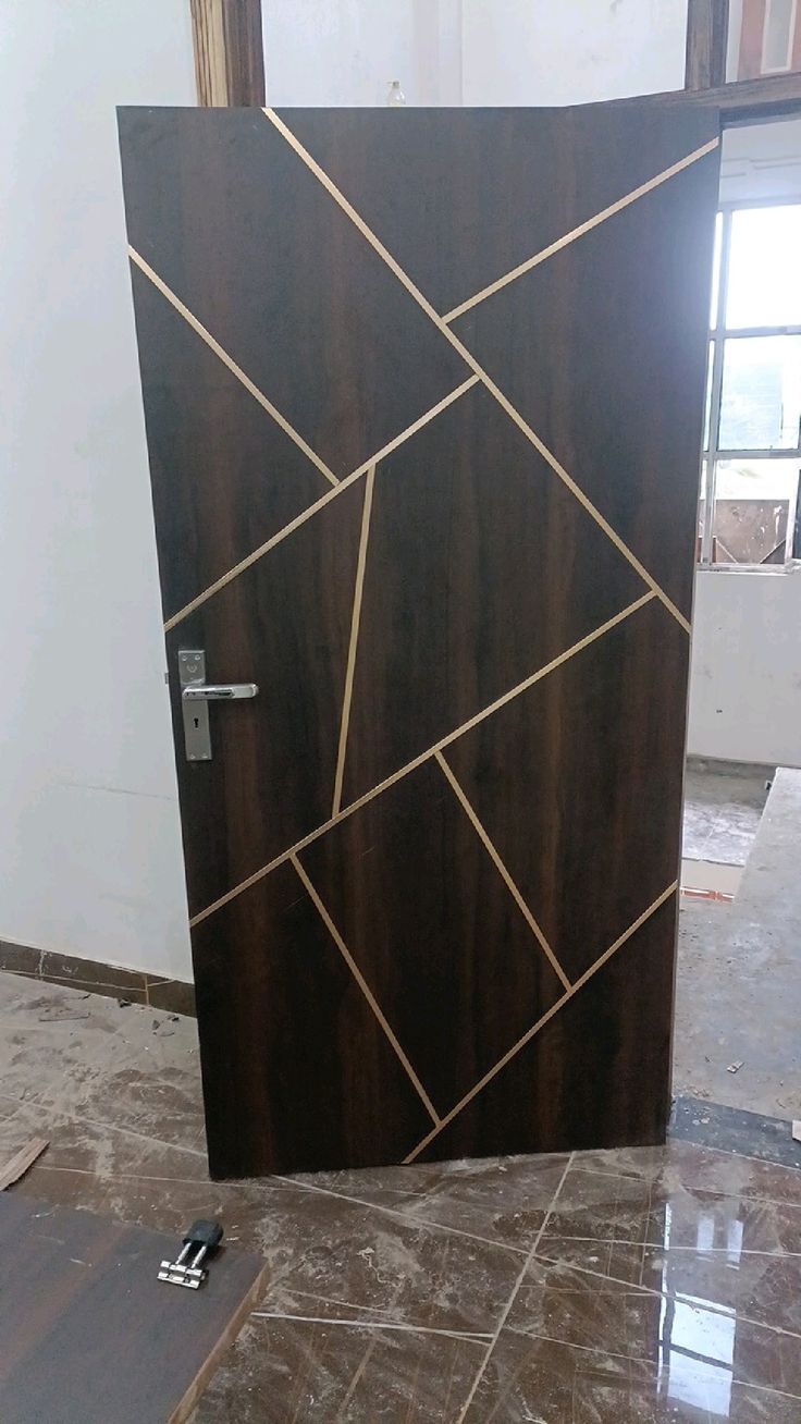 the door is made out of wood and has gold lines on it's sides