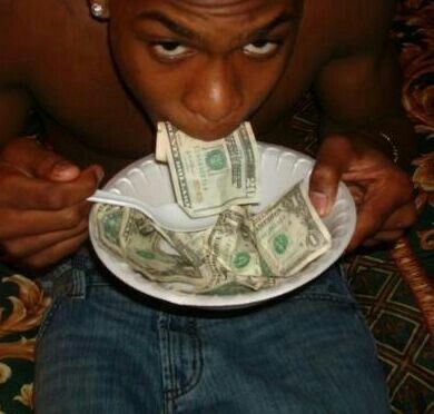 a man holding a plate with money in it