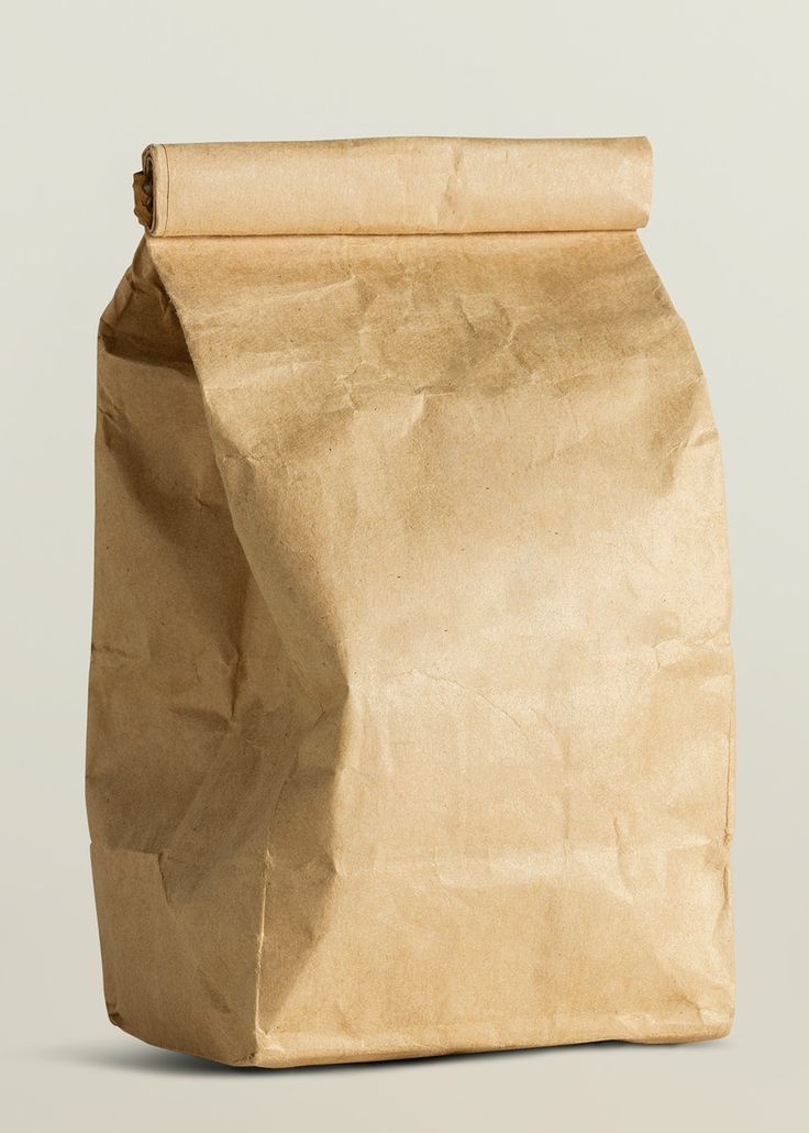 a brown paper bag sitting on top of a white table