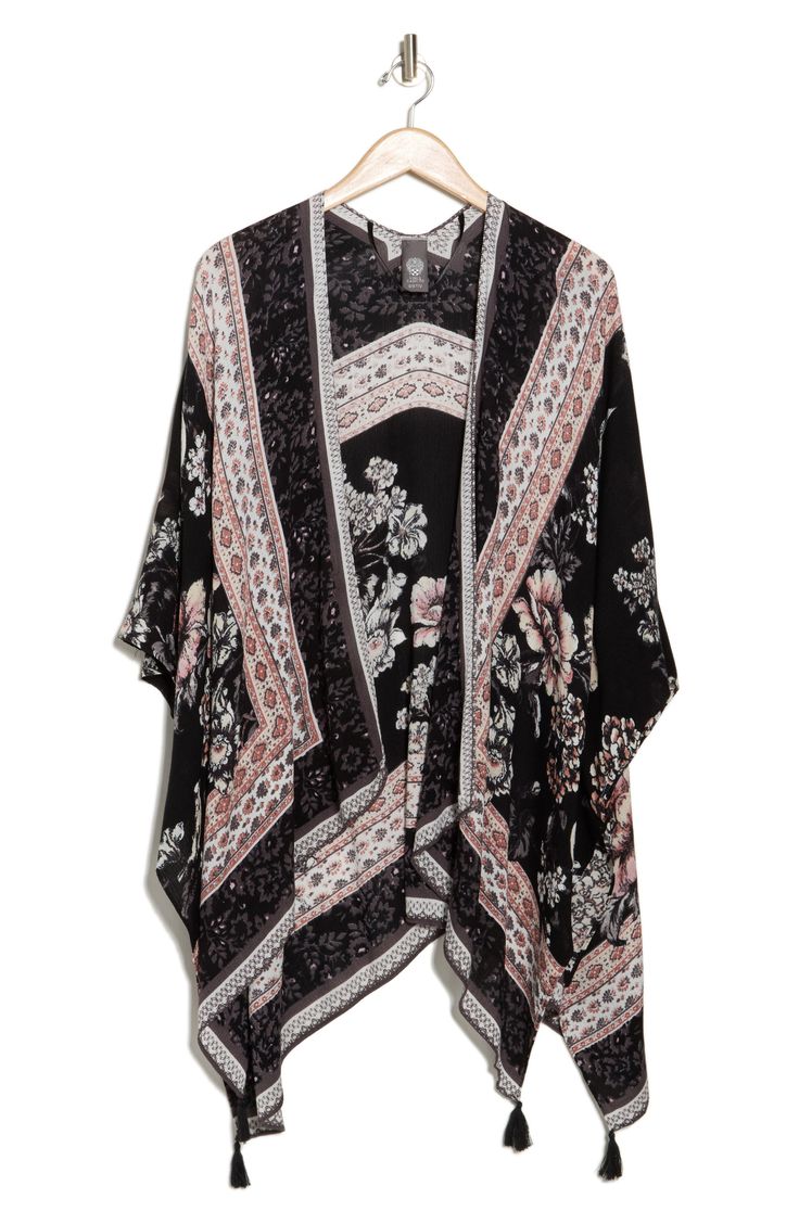 Love to layer this lightweight ruana that is covered in a garden bird design that is perfect for your next warm-weather adventure. 36" length (size O/S) Open front Short sleeves 100% rayon Hand wash, dry flat Imported Black Shawl Kimono For Spring, Casual Summer Outerwear With Boho Print, Casual Shawl Poncho For Spring, Casual Boho Print Outerwear For Spring, Bohemian Black Outerwear For Vacation, Black Bohemian Outerwear For Vacation, Bohemian Floral Print Outerwear For Vacation, One Size Summer Floral Print Outerwear, Summer Printed Patterned Outerwear