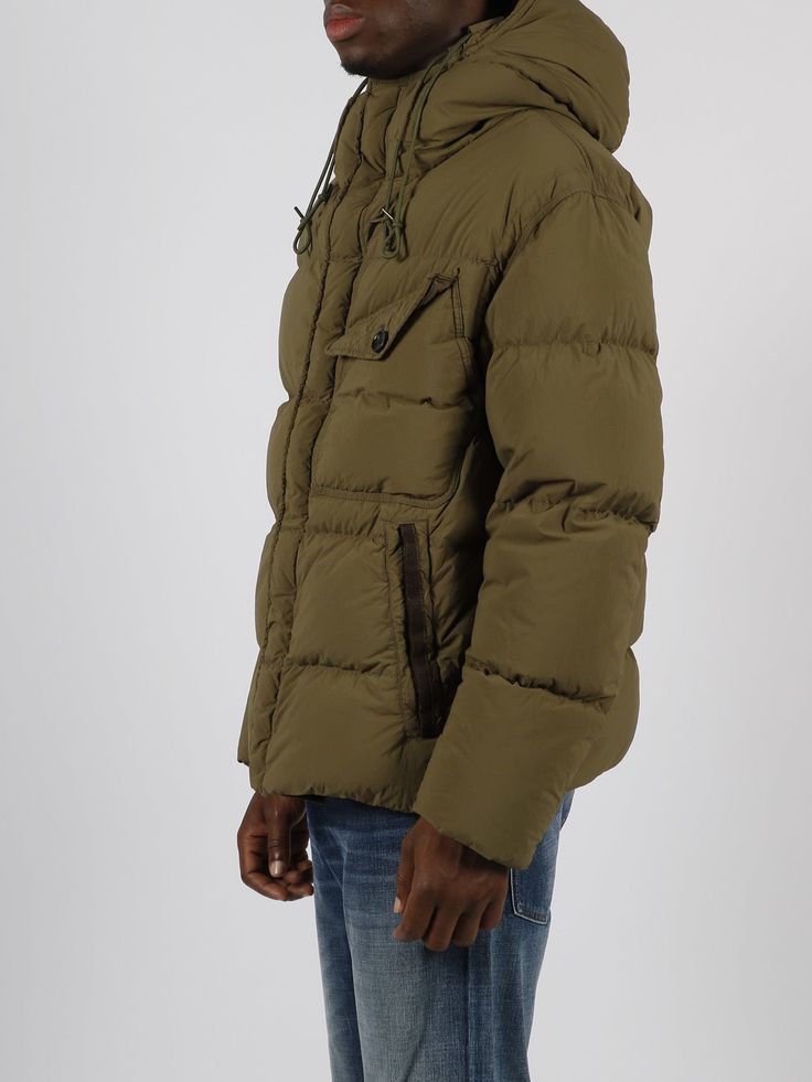 Survival down jacket by Ten C, in quilted nylon. - FW22 - Hood with double drawstring - Zip closure and flap with press studs - Side pockets with zip - Patch pocket on the chest - Drawstring at the bottom - Made in Georgia - 100% Polyamide Quilted Utility Jacket For Winter, Hooded Down Quilted Jacket With Zipper Closure, Hooded Quilted Down Jacket With Zipper Closure, Hooded Quilted Down Jacket With Pockets, Casual Down Parka With Zipper Closure, Quilted Nylon Parka For Cold Weather, Quilted Nylon Parka For Outdoor, Casual Down Parka With Zipper, Outdoor Quilted Duck Down Jacket With Detachable Hood