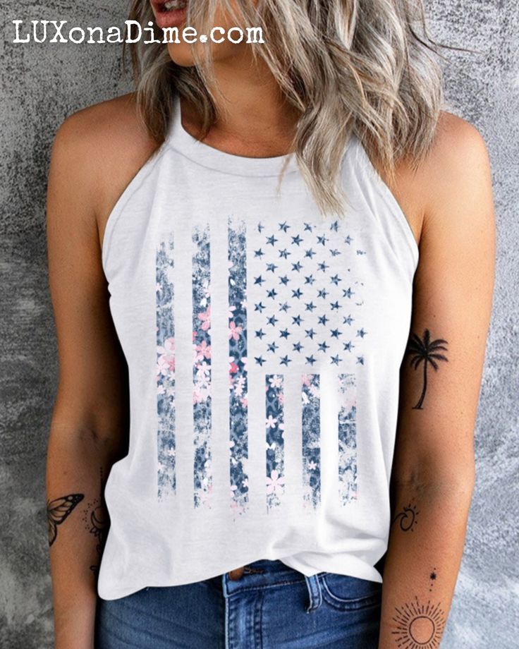 American Flag Floral Graphic Shirt Patriotic Sleeveless Grecian Tank Top This classic Americana-style t-shirt is ideal for the all-American woman !Features an American flag in a subtle floral pink print in a rustic retro vintage style.Grecian spaghetti strap cami shirt is comfortable, lightweight, slightly stretchy.Perfect for pairing with jeans or shorts for the summer.Wear everyday showing your love our military troops, holidays like 4th of July, independence day, Veterans or election season. Everyday Tank Tops, Americana Style, Classic Americana, Cami Shirt, Vintage American Flag, Blank Apparel, American Flag Print, Halter Tank Top, Graphic Tank Tops