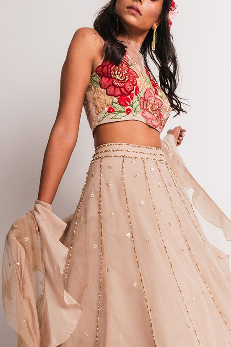 Beige high waist lehenga with sequin, bead and pearl embroidered motifs. Comes with crop top and dupatta.
Components:3
Embroidery
Neckline:Round
Sleeve Length:Sleeveless
Fabric:Tulle
Color:Beige
Applique embroidered floral motifs and sequin and pearl motifs on top
Sheer dupatta with sequin motifs and ruffle border - Aza Fashions Organza Choli With Intricate Embroidery For Reception, Bollywood Style Embellished Choli For Reception, Embroidered Party Wear Choli For Reception, Party Choli With Intricate Embroidery In Georgette, Bollywood Style Organza Choli For Reception, Resham Embroidered Organza Choli For Reception, Embellished Party Wear Choli For Reception, Designer Embellished Organza Lehenga, Embellished Anarkali Organza Choli