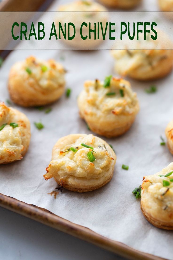 small crackers with cheese and chives on a baking sheet